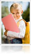 Smiling Young Girl on the first day at school